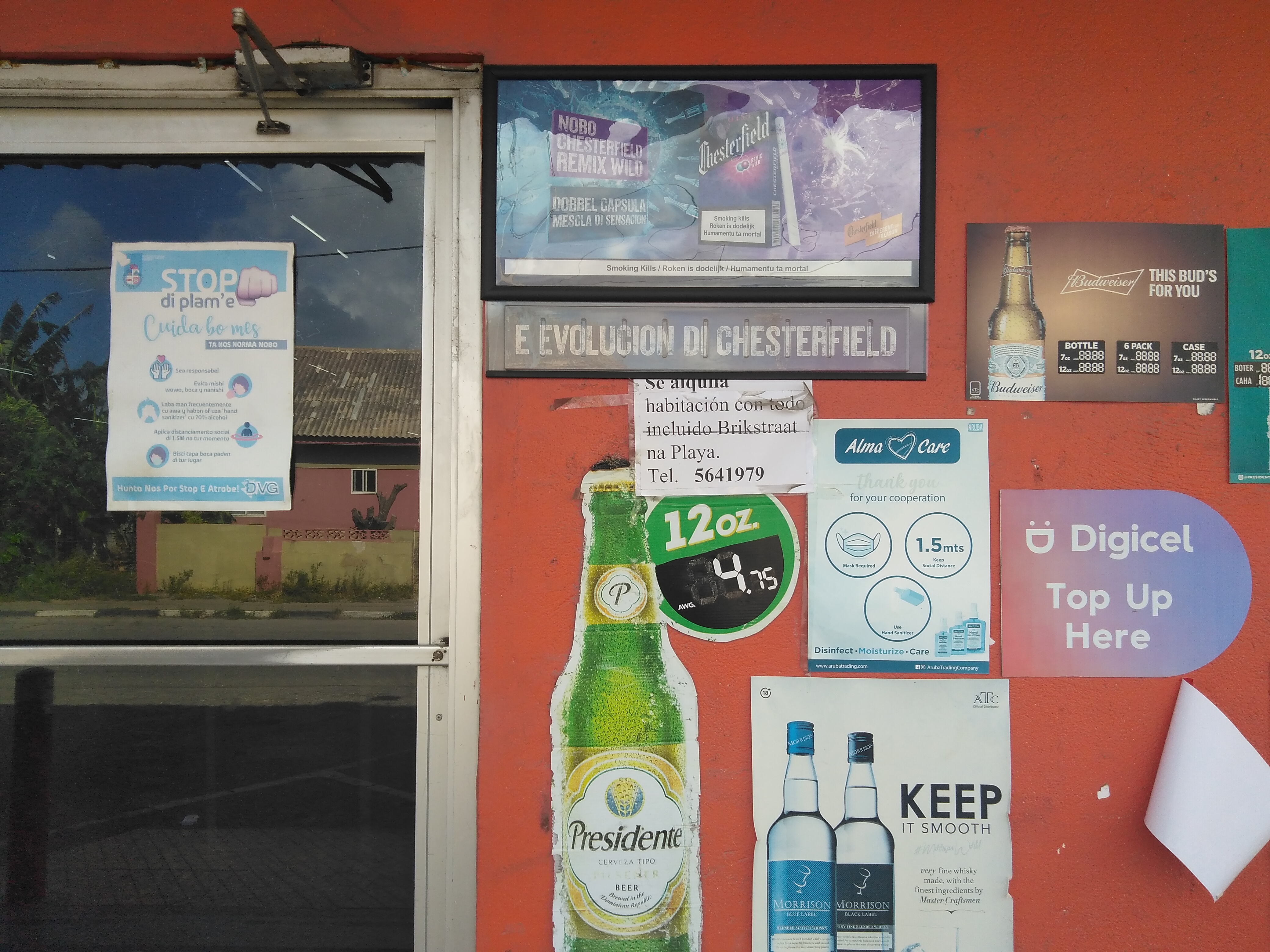 A storefront in Oranjestad (look at the health warning on the cigarette advert).